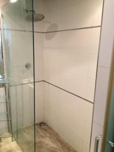 a shower with a glass door in a bathroom at Valletta Heritage Town House in Valletta +6 photos
