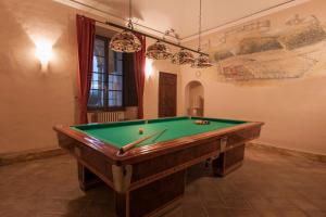 a room with a pool table in a room at Certosa di Pontignano Residenza d'Epoca in Ponte A Bozzone