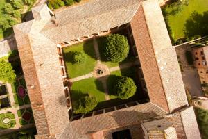 an overhead view of a garden with trees and a building at Certosa di Pontignano Residenza d'Epoca in Ponte A Bozzone