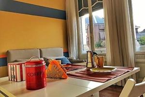 a red can sitting on a table in a room at Residenza in Palazzo d'Epoca in Milan