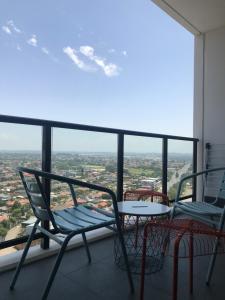 a balcony with chairs and a table and a view at New Luxurious Skyview 2Bedroom Apartment Liverpool in Liverpool