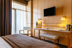 Cama ou camas em um quarto em Axis Vermar Conference & Beach Hotel