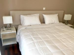 Un pat sau paturi într-o cameră la EVA´S HOME