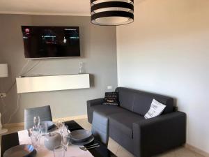 TV a/nebo společenská místnost v ubytování Calypso Home Sea View