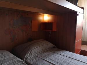 A bed or beds in a room at Checchi House