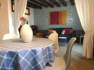 a living room with a table and a couch at Canal view apartment in Venice