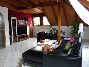 a living room with a couch and a table at Ferienwohnung Terhar in Viereth-Trunstadt