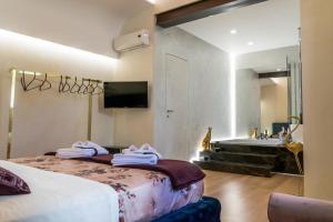 a hotel room with a bed and a sink at Diodorus Luxury Experience in Favara