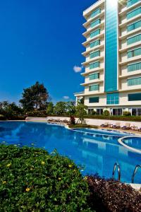 a large swimming pool in front of a building at Champasak Grand Hotel in Pakse