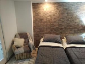 Postel nebo postele na pokoji v ubytování Design House Corrientes