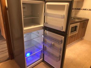 Kuchyň nebo kuchyňský kout v ubytování Apartamentos Augusto