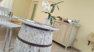 a wooden table in a kitchen with a chair at B&B Vivere il Mare in Numana