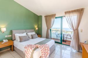 Postel nebo postele na pokoji v ubytování Pela Mare Hotel
