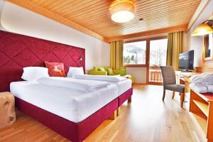 Postel nebo postele na pokoji v ubytování Hotel NockResort