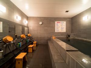 a row of sinks in a large room at Super Hotel Takamatsu Tamachi in Takamatsu