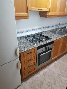 a kitchen with a stove and a sink at Isabel in Valencia