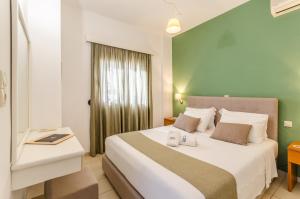 Postel nebo postele na pokoji v ubytování Pela Mare Hotel