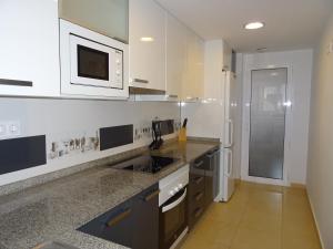 Kuchyň nebo kuchyňský kout v ubytování Apartamento Azul Beach La Mata Playa