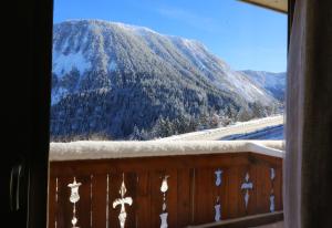 a view from a cabin overlooking a mountain range at Hotel Edelweiss in Courchevel