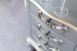a close up of a dresser with wine glasses at Grovefield Manor in Poole