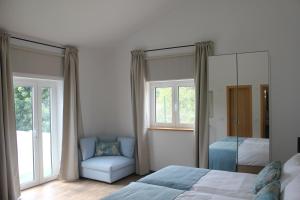 Ένα ή περισσότερα κρεβάτια σε δωμάτιο στο Monte das Perdizes