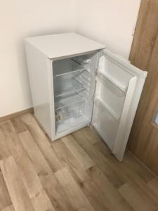 a white refrigerator with its door open in a room at Apartment Simona in HoÅ¡Å¥ka