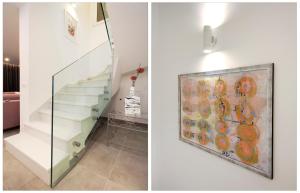 a staircase in a house with a glass wall at Villa Karla in Makarska
