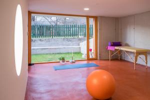 a room with an orange ball in the middle of a room at HOMe apartments & Yoga studio in Bled-Rečica