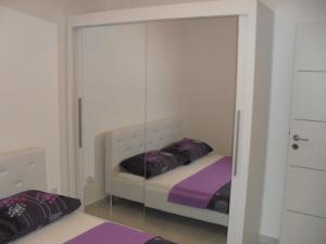 Postel nebo postele na pokoji v ubytování Apartments Govic