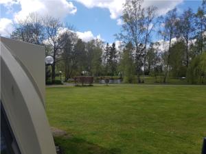 a view of a park with a field of grass at Iglo Bungalow 93 in Chaam