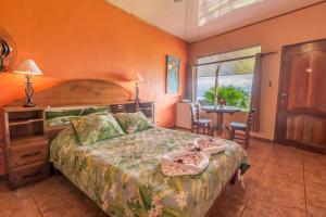 Ein Bett oder Betten in einem Zimmer der Unterkunft Hotel Nepenthe B&B