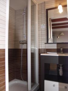 a bathroom with a shower and a sink at Cit'Hotel Hôtel Beauséjour in Cherbourg en Cotentin