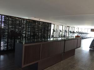 a room with a row of vases on a counter at La Isla Gran Cayman 904 in Acapulco