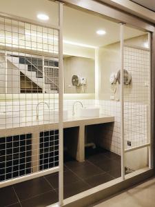 a bathroom with a sink and a mirror at LITA Bangkok in Bangkok