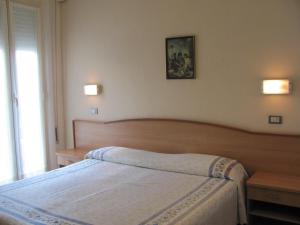 Postel nebo postele na pokoji v ubytování Albergo Moretti