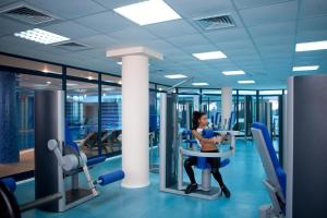 The fitness centre and/or fitness facilities at Astera Hotel & Spa with FREE PRIVATE BEACH