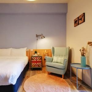 A bed or beds in a room at See U Tainan Apartment