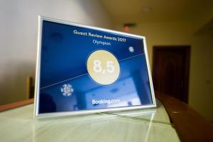 Certificado, premio, señal o documento que está expuesto en Olympion