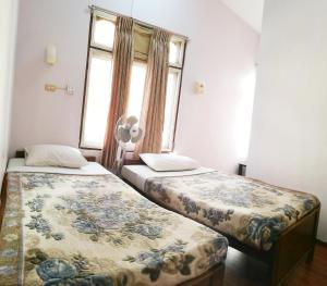 Ένα ή περισσότερα κρεβάτια σε δωμάτιο στο Gypsy Inn