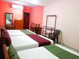 Postel nebo postele na pokoji v ubytování Randhi La Beach View Lounge