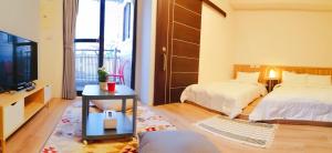 A bed or beds in a room at See U Tainan Apartment