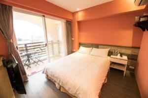 Postel nebo postele na pokoji v ubytování Banff-Penghu B&B