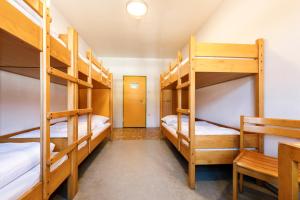 Ένα ή περισσότερα κρεβάτια σε δωμάτιο στο Jugendherberge Schliersee +23 φωτογραφίες