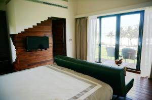 Postel nebo postele na pokoji v ubytování Coconut Beach Homestay