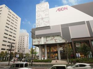 a building with cars parked in front of it at Ark Hotel Okayama -ROUTE INN HOTELS- in Okayama
