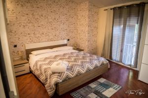 Ένα ή περισσότερα κρεβάτια σε δωμάτιο στο Hotel Lonatino