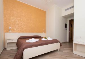 A bed or beds in a room at B&B Vista Santuario