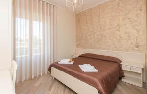 A bed or beds in a room at B&B Vista Santuario