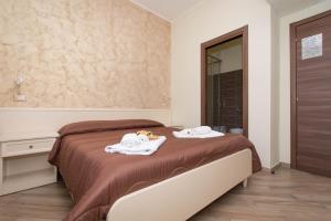 A bed or beds in a room at B&B Vista Santuario