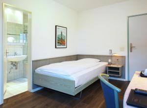 Postel nebo postele na pokoji v ubytování Sommerau-Ticino Swiss Quality Hotel + 20 fotografií